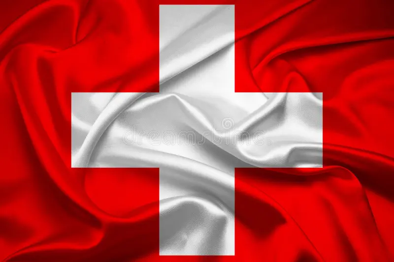 Bandera de Suiza ondeando, tela roja y cruz blanca.